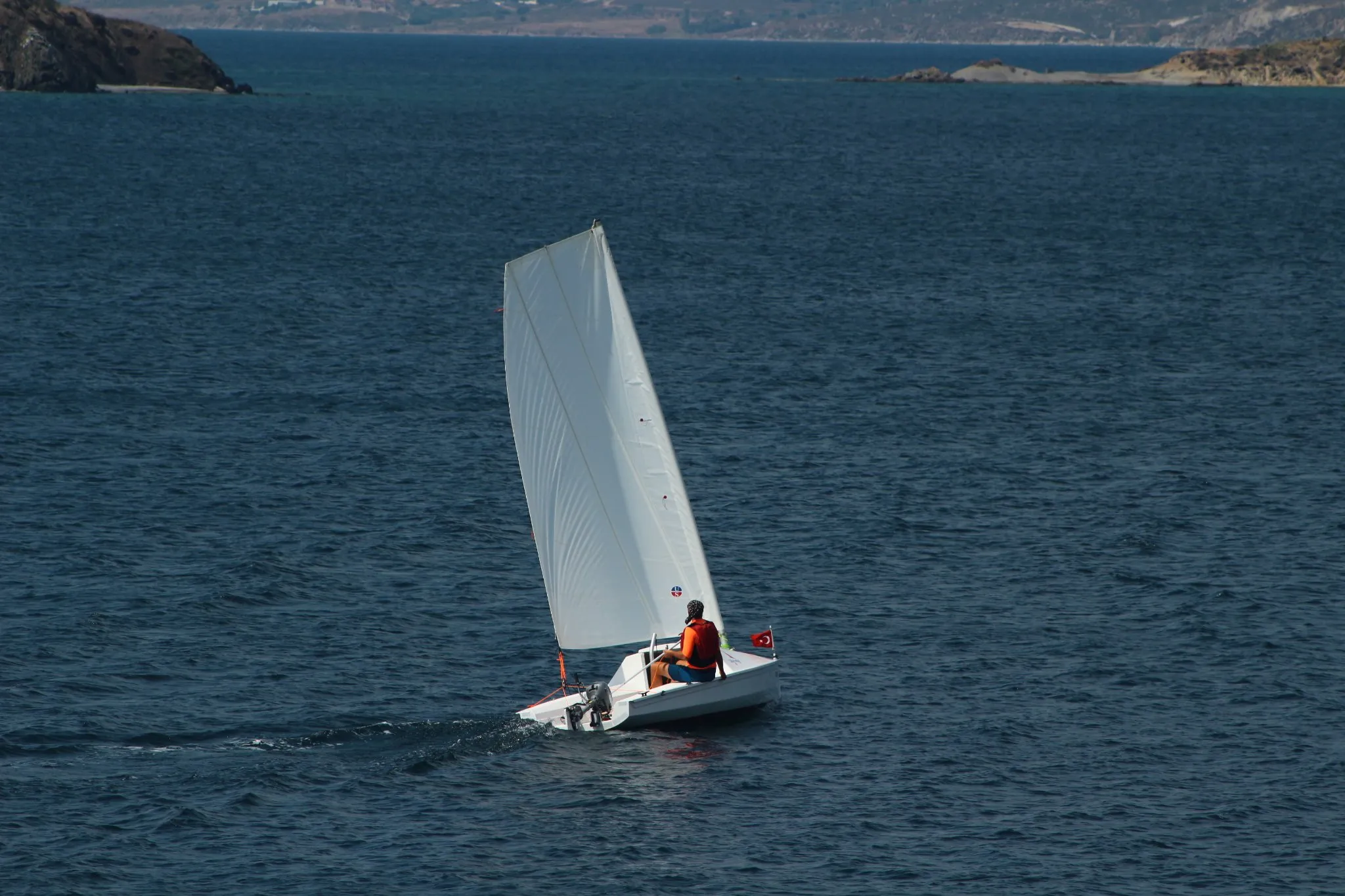 The U530 sailing under full sail on a deep-blue sea